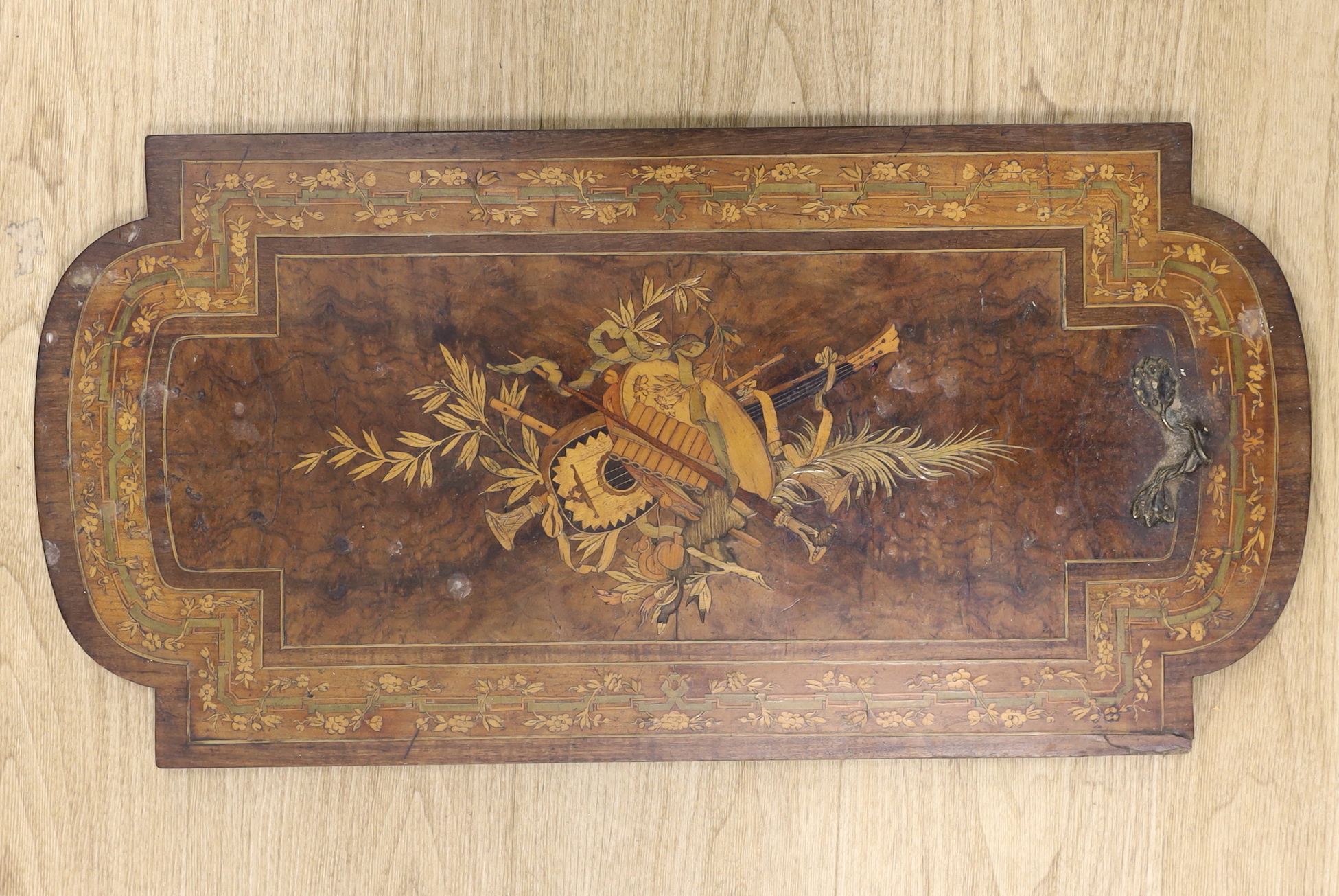 A French marquetry inlaid 'trophy' panel, 69.5 x 35cm